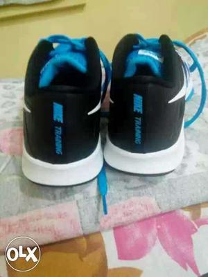 Pair Of Black-blue-and-white Nike Training Shoes
