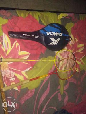 Pair Of Yellow-and-red Badminton Rackets