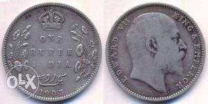Two Round Silver-colored One Rupee Coins