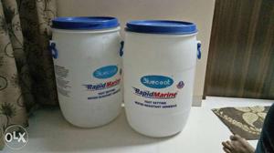 Two White-and-blue Plastic Drum Containers