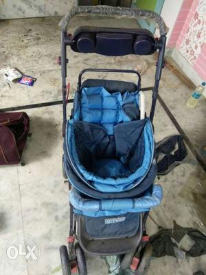 Baby's Blue And Black Car Seat Stroller
