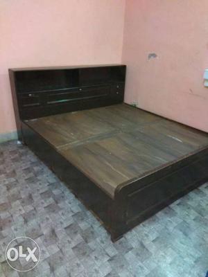 One double bed with box and without mattress and