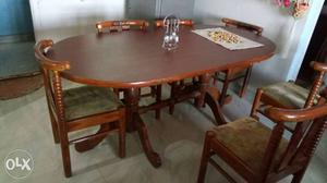 Oval Brown Wooden Table With Chairs