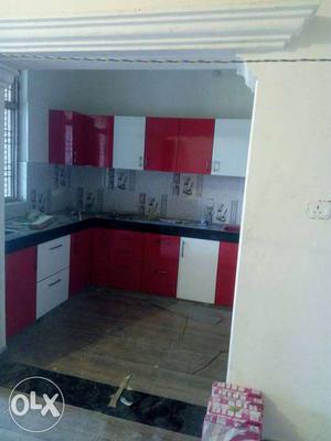 Red And White Wooden Kitchen Cabinet