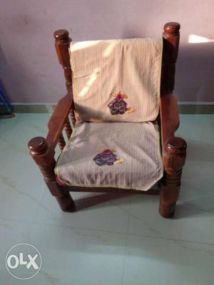 Two Brown Wooden Framed White Padded Armchair