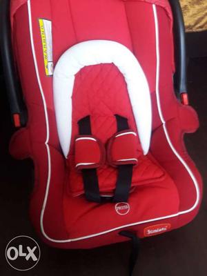 Baby's Red And White Car Seat Carrier