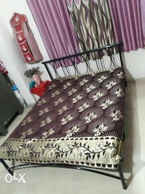 Black Metal Framed Brown And White Floral Fabric Bedsheet