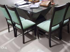 Brand new dinning table with 4 chairs.