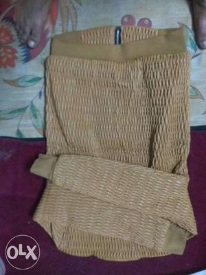 Brown Wicker Armchair With Throw Pillow