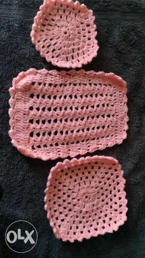Several Pink Knitted Doilies