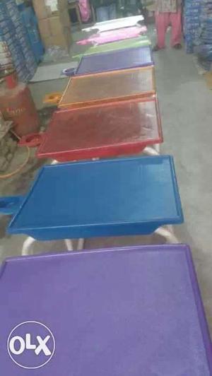 Several Wooden Multicolored Tables