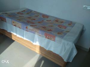Solid wood single bed with storage