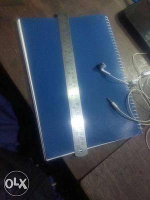 Stainless Steel Ruler And Blue Spiral Book