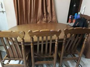 Wooden dinning table set along with 4 wooden chairs