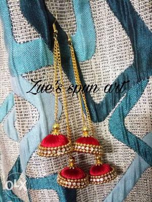 A very beautiful red and gold handmade earring.