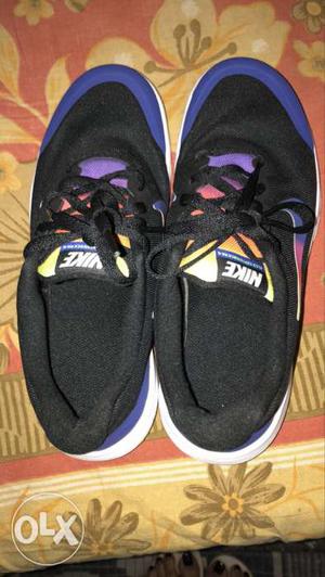 Pair Of Black-and-purple Nike Low-top Sneakers