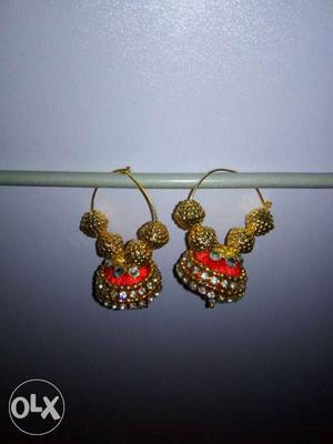 Pair Of Gold-colored And Red Beaded Jhumka Earrings