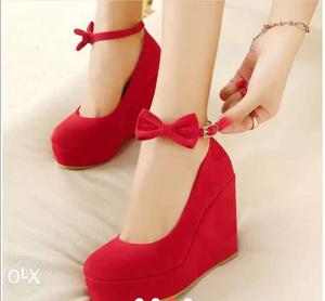 Pair Of Red Suede Closed-toe Wedge Sandals