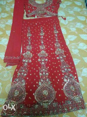 Size-large,colour-red,with golden embroidery work