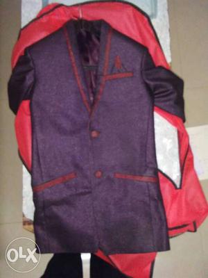 This is purple colour blazer with red boundary