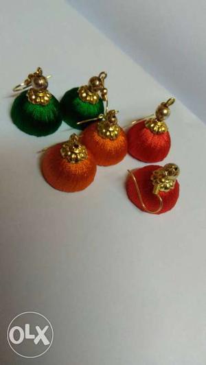 Tree Pairs Of Green, Orange, And Red Jumkah Earrings