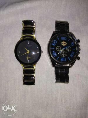 Two Round Black Chronograph Watches With Link Bracelets