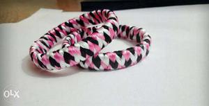Two White-pink-and-black Woven Bracelets