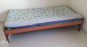 2 single beds. Wood frame and mattress. 