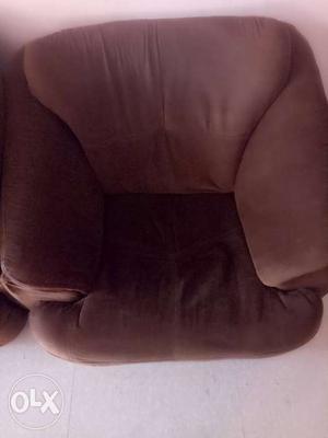 Brown Suede Sofa Chair With Throw Pillow