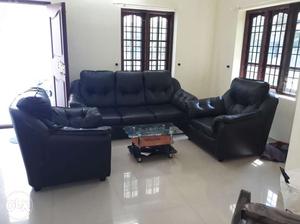 Leather sofa set with small table