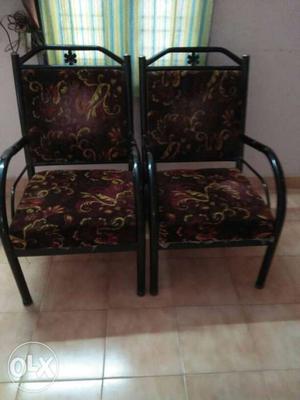 Two Brown Wooden Floral Padded Chairs
