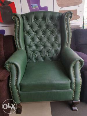 BRAND NEW Wing chair in green colour available in lowest