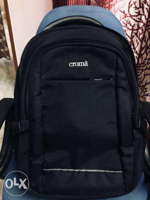 Black Croma Dslr and Tourist Backpack.