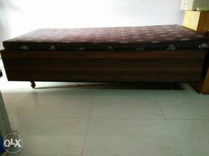 Brown Wooden Bed Frame With Brown Fabric Mattress