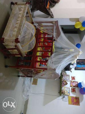 Brown Wooden Crib With Mosquito Net