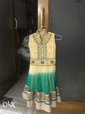 Green colour with beige contrast anarkali suit