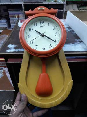 Orange And Brown Pendulum Wall Clock
