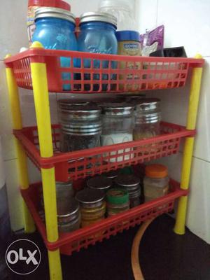 Red And Yellow Plastic Rack with containers