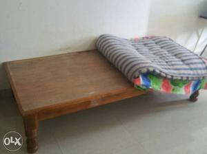 Single wooden bed with free cotton mattress.