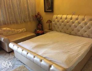 Upholstered bed with matching couch