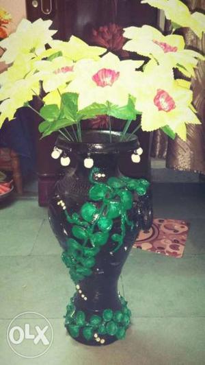 Yellow Petaled Artificial Flowers With Black Ceramic Vase