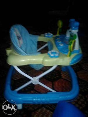 Blue and white walker for baby.In a good condition and also