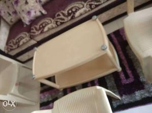Rectangular Beige Plastic 2-tier Table with three chairs...
