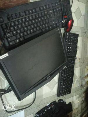 Black Flat Screen Computer Monitor With Keyboard