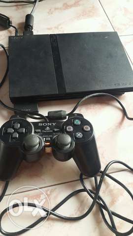 Black Sony PS3 Console With Two Controllers