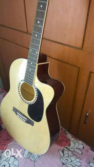 Brown Wooden Cutaway Acoustic Guitar