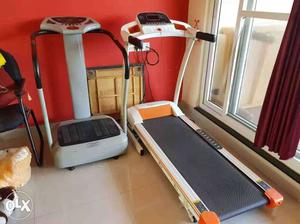 Gray Vibrating Plate And White Treadmill
