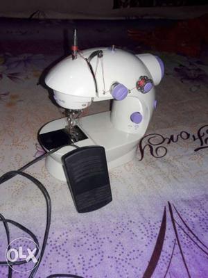 Mini sewing machine consists of everything.