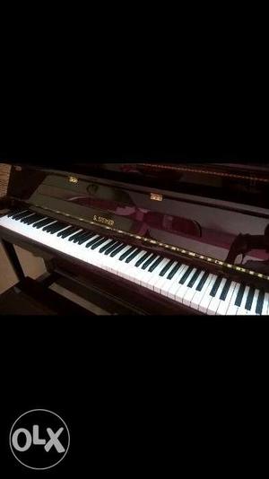 New piano With cover and metronome.