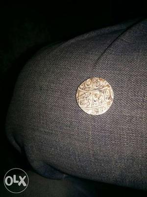 Round Gold-colored Mughal Coin